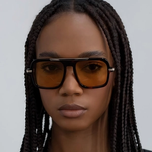 Fashionable oversized square pilot sunglasses with tortoiseshell frames and amber lenses