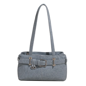 Vintage blue denim shoulder bag with decorative belt buckle and silver hardware