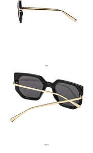 Detail view of black geometric frames and slim gold metal temples from side and back