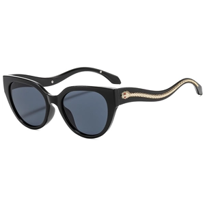 Lunettes de soleil œil de chat noires avec détail serpent doré sur les branches, vue de profil