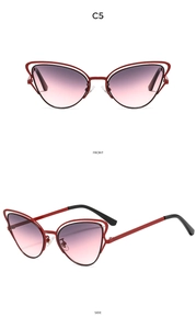 Dettaglio occhiali da sole cat eye con doppia montatura in metallo rosso C5 e sfumatura
