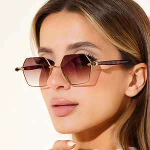 Chic hexagonal metal sunglasses with gradient lenses and tortoiseshell temples on model