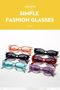 Detailed view of colorful bat-wing sunglasses in pink red and blue for party events
