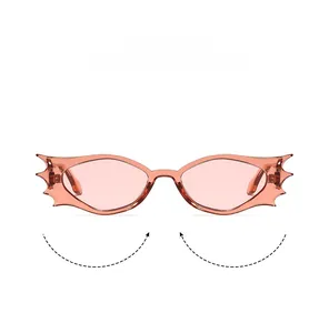 Detailed view of pink batwing cat-eye sunglasses with flame-shaped punk frame accents