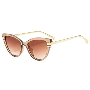 Fashionable women's cat-eye sunglasses with gradient brown lenses and golden metal temples