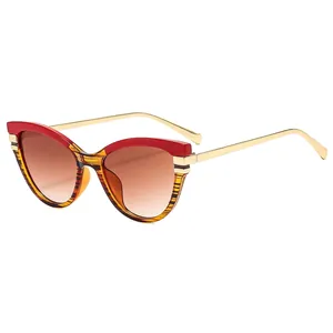 Retro cat-eye sunglasses with tortoiseshell red frame and gradient brown lenses