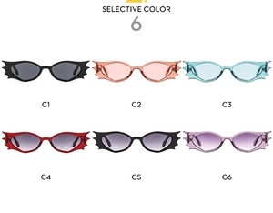 Selection of bat-shaped sunglasses in six vibrant colors for rave and party fashion