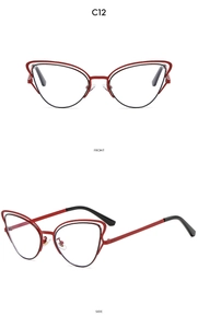 Dettaglio montura cat-eye in metallo rosso con design a doppio strato e punte nere