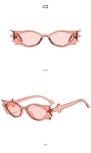 Front and side views of pink bat-shaped cat eye sunglasses with sharp decorative edges