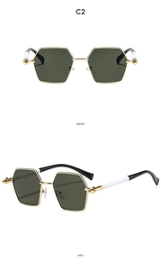 Front and side view of hexagonal metal sunglasses with green lenses and gold frames