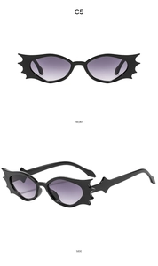 Front and side views of black bat wing sunglasses with purple gradient lenses