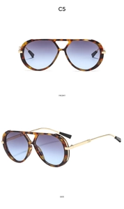 Close-up of double bridge pilot sunglasses with tortoiseshell frames and gradient lenses