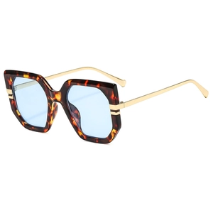 Stylish oversized tortoise geometric sunglasses with blue lenses and gold metal temples