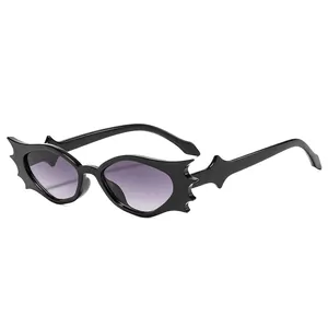 Gothic bat-wing sunglasses with black frames and purple gradient lenses on a white background