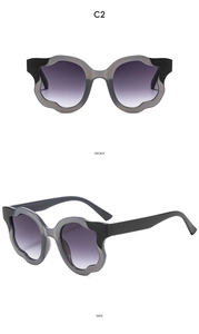Detailed front and side views of irregular wavy black and grey color-block sunglasses