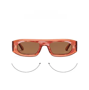 Detail of square orange marble pattern sunglasses frame with brown lenses on white background