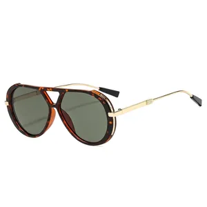 Classic tortoiseshell double-bridge aviator sunglasses with gold metal temples on white background