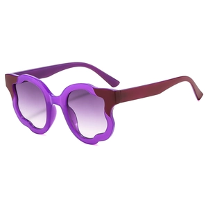 Fashionable oversized irregular cat eye sunglasses with purple wavy frames and gradient lenses