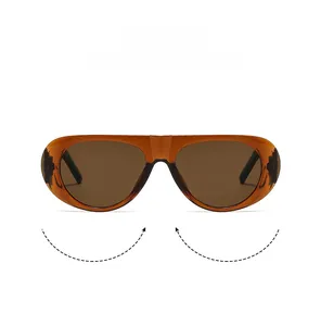 Detail of amber translucent wrap-around sunglasses with dark brown lenses and side shields
