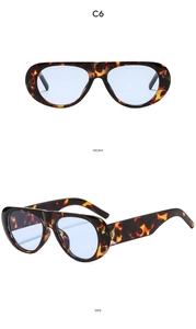 Detail view of oval tortoise shell sunglasses with light blue lenses showing front and side