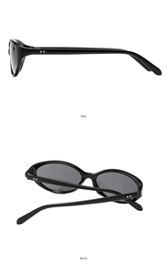 Detail view of black oval sunglasses frames featuring silver double rivet accents