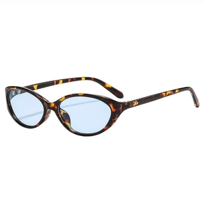 Retro cat-eye sunglasses featuring tortoiseshell frames and blue translucent lenses