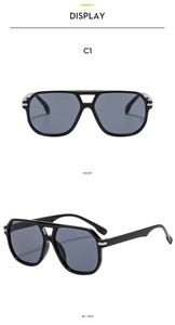 Detail view of double bridge sunglasses with black frames and grey lenses, front and side angles