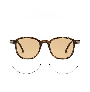 Detail view of tortoiseshell square frame sunglasses with amber lenses and metal accents