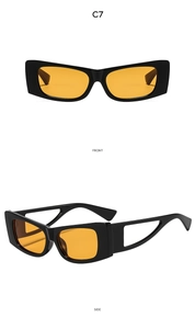 Detail view of cat eye sunglasses with hollow geometric temples and orange lenses