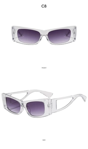 Detail view of cat eye sunglasses with purple gradient lenses and hollow geometric temples