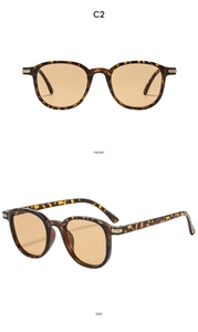 Detailed front and side views of tortoiseshell sunglasses with gold metal accents