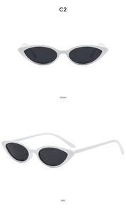 Front and side views of vintage cat eye sunglasses with white frames and dark lenses