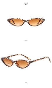 Detail view of leopard print cat eye sunglasses with brown gradient lenses and C7 model