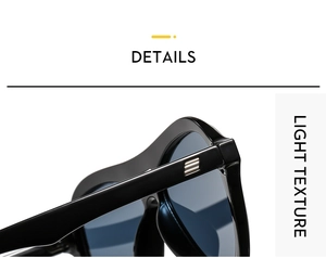 Detail view of black vintage sunglasses featuring silver triple stripe metal accents on temples