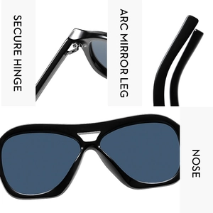 Detail view of durable metal hinges and ergonomic temples on black oversized sunglasses