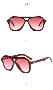 Front and side views of oversized retro wine red sunglasses with pink gradient lenses
