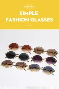Detail of Y2K oval sunglasses with golden S-shaped temples and lion head ornaments