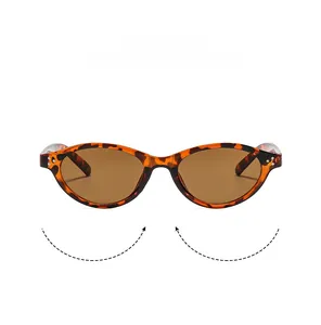 Close-up of tortoise shell cat eye sunglasses with silver rivets on the frame corners
