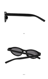 Side and back view of Y2K oval black sunglasses with wide arms and smooth frame