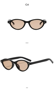 Detail of black oval Y2K sunglasses with triple stud accents and tinted brown lenses