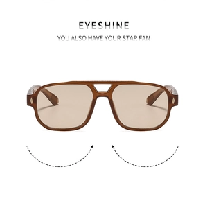 Detail of vintage aviator sunglasses with brown double bridge frame and metal studs