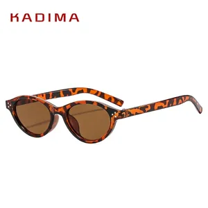Retro oval tortoiseshell sunglasses with dark brown lenses and classic metal rivet accents