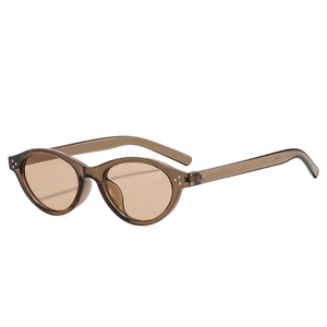 Y2K vintage oval cat-eye sunglasses with translucent brown frames and metal rivets
