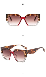 Detail of square oversized tortoiseshell and red sunglasses with brown gradient lenses
