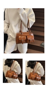Detail view of brown bowling bag showing twin front pockets with metallic buckle accents