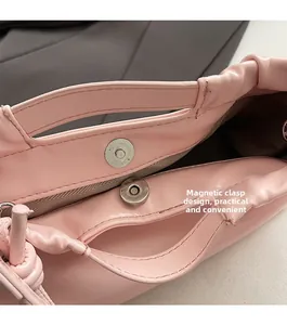 Pink PU leather bag interior featuring herringbone lining and magnetic closure detail