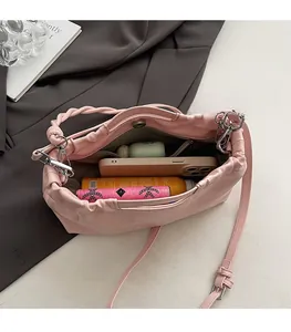 Top view of pink drawstring pleated bag showing large capacity for essentials