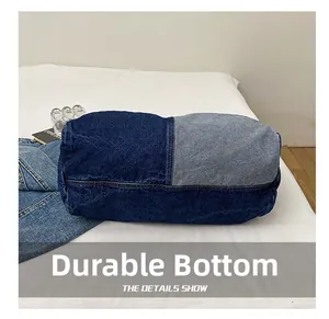 Close-up of wear-resistant denim tote bag bottom with reinforced double stitching