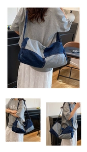Detail view of denim patchwork tote bag showing blue stitching and large capacity design