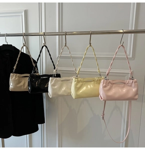 Multi-color PU shoulder bags hanging in beige, black, white, yellow, and pink colors